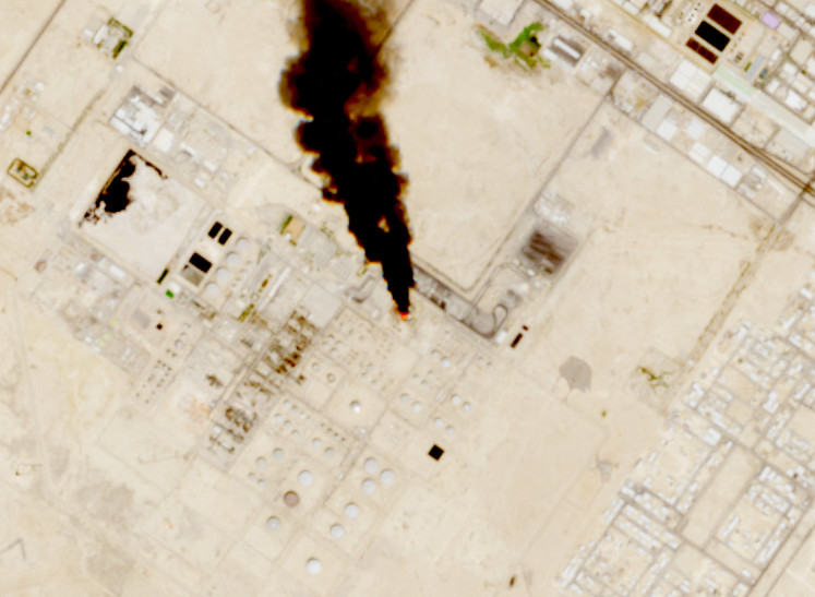 Smoke rises from the site of the Saudi Aramco refinery after reported Houthi attacks, south of Riyadh, Saudi Arabia, in this handout satellite image taken on October 3, 2026.