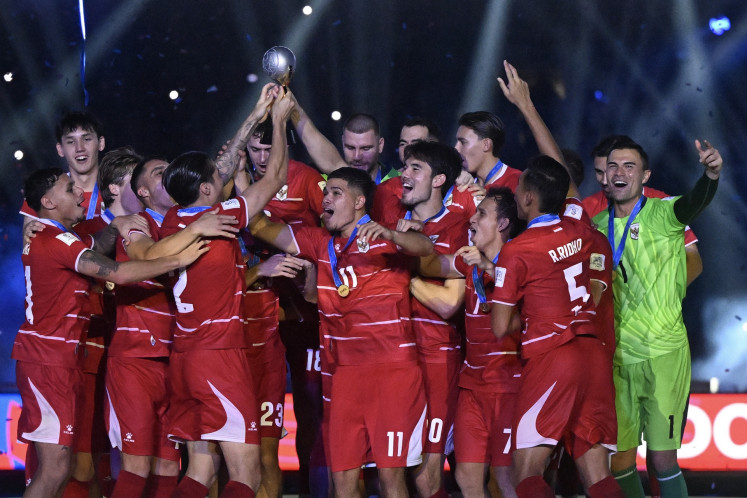 Indonesia's national men's soccer team players lift the FIFA ASEAN Cup 2026 trophy at the main Gelora Bung Karno (GBK) Stadium in Central Jakarta on Oct. 5, 2026. Indonesia won the inaugural FIFA-sanctioned competition after beating Thailand 4-2 on penalties with both teams tying 2-2 after extra times.