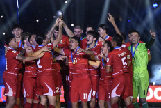 Indonesia's national men's soccer team players lift the FIFA ASEAN Cup 2026 trophy on Oct. 5 at the main Gelora Bung Karno (GBK) Stadium in Central Jakarta. Indonesia won the inaugural FIFA-sanctioned competition after beating Thailand 4-2 on penalties with both teams tying 2-2 after extra time.