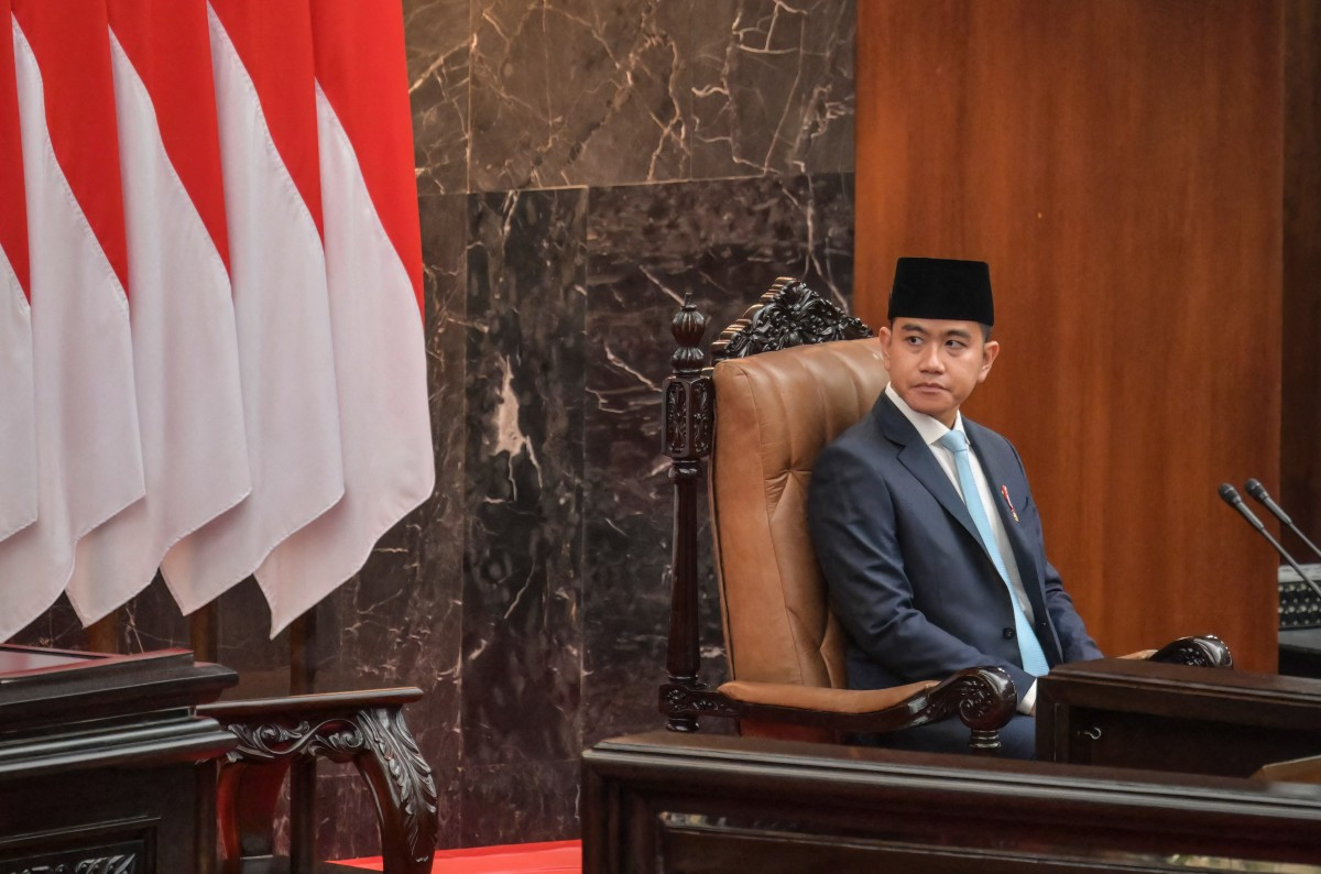 Vice President Gibran Rakabuming Raka looks on before President Prabowo Subianto's speech on the macroeconomic framework to lawmakers on May 20 at the Senayan Legislative Complex in Jakarta.
