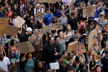 People take part in a demonstration part of a nationwide day of actions called by high-school students, joined by unions and teachers, who for days have been demanding better learning conditions in protests punctuated by violent confrontations in Paris on October 6, 2026. Students have blocked the entrances to hundreds of high schools for 15- to 17-year-olds since late September, complaining of missing teachers, overloaded timetables, dilapidated classrooms and buildings that cannot cope with rising temperatures.