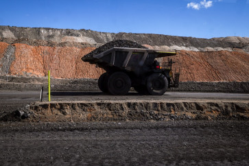 A coal hauler truck drives along a road with a load at the Moolarben coal mine, operated by Yancoal Australia, located in the western New South Wales coalfields and north of the town of Mudgee on September 3, 2026. Australia's coal mines are expanding as exports boom, awkward timing for a nation preparing to champion clean energy as lead negotiator for the UN's climate summit.