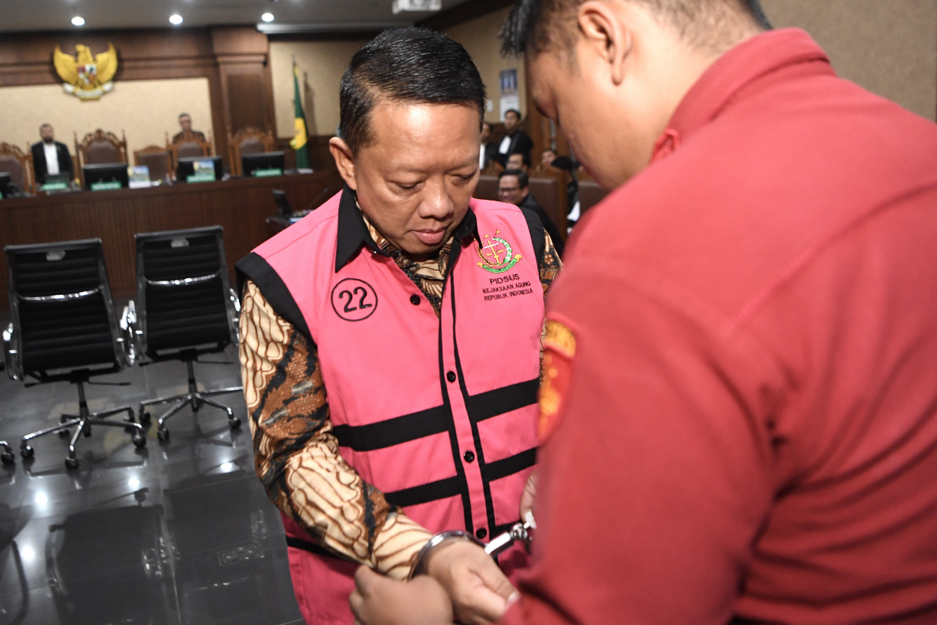 Defendant Febrie Adriansyah (left) prepares to attend his indictment hearing on Oct. 7 at the Jakarta Corruption Court. The former deputy attorney general for special crimes was charged with allegedly receiving Rp 55 billion (US$3.3 million) in connection with an extortion and money-laundering case involving Rp 354 billion.