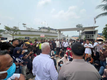 Residents of Nongsa district in Batam, Riau Islands, block access to Nongsa Digital Park during a protest on Oct. 5, 2026, over months of water shortages in their community, while water supplies to data centres in the park remain uninterrupted.


