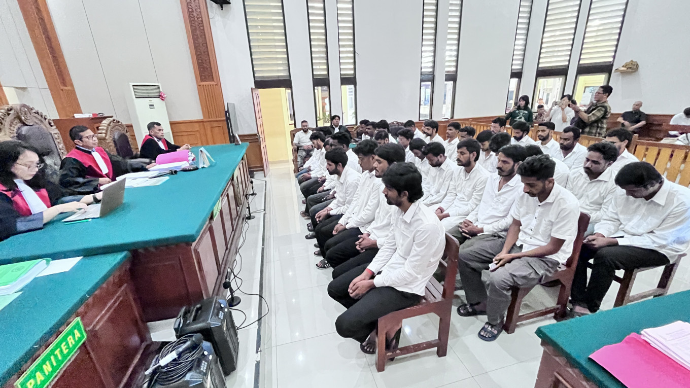 Thirty-five Indian nationals sit before judges on Oct. 7 at the Denpasar District Court during their verdict hearing in an online gambling case. They were sentenced to between two and two-and-a-half years in prison and will be deported and barred from re-entering Indonesia after serving their sentences.

