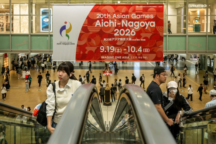 Massive splash: A large banner promoting the 20th Asian Games hangs on Sept. 16, 2026 above a concourse at Nagoya Station, a major railway hub in the capital of Aichi prefecture, Japan.