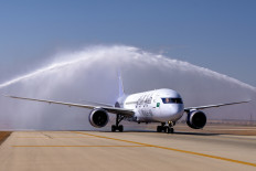 A Boeing 787-9 Dreamliner of Saudi Arabia's second flag carrier Riyadh Air receives a customary water salute on its first landing at an undisclosed airport in this undated picture. 