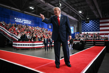 US President Donald Trump points to the crowd as he walks off stage after speaking at a campaign rally at the Oncenter Convention Center in Syracuse, New York, on October 9, 2026.
President Trump is campaigning for Republican nominee for New York governor, Bruce Blakeman, as well as other Republican candidates in November's general election.
