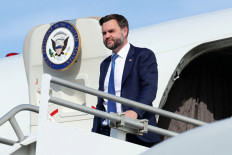 US Vice President JD Vance disembarks Air Force Two as he arrives at Cincinnati/Northern Kentucky International Airport, following a rally in Lima, Ohio, in Hebron, Kentucky, US, October 9, 2026. Vance traveled to Ohio to cast his early ballot and campaign for local Republican candidates ahead of the midterm elections.
