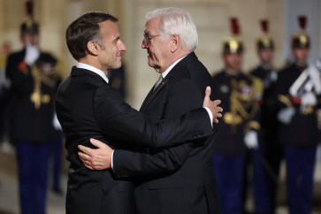 French President Emmanuel Macron greets German President Frank-Walter Steinmeier upon the Steinmeier's arrival ahead of a state dinner at The Elysee Presidential Palace in Paris on Oct. 8, 2026.
The dinner was held during Steinmeier's state visit to France.