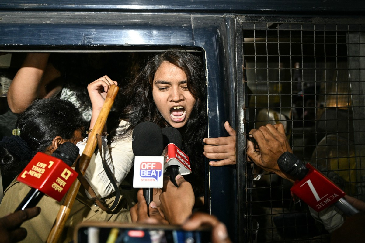 Police personnel detain supporters of the Cockroach Janata Party (CJP) during a protest demanding the resignation of India&rsquo;s Chief Election Commissioner Gyanesh Kumar over alleged voter roll irregularities linked to the &ldquo;special intensive revision&ldquo; (SIR), in Ahmedabad on October 10, 2026. 