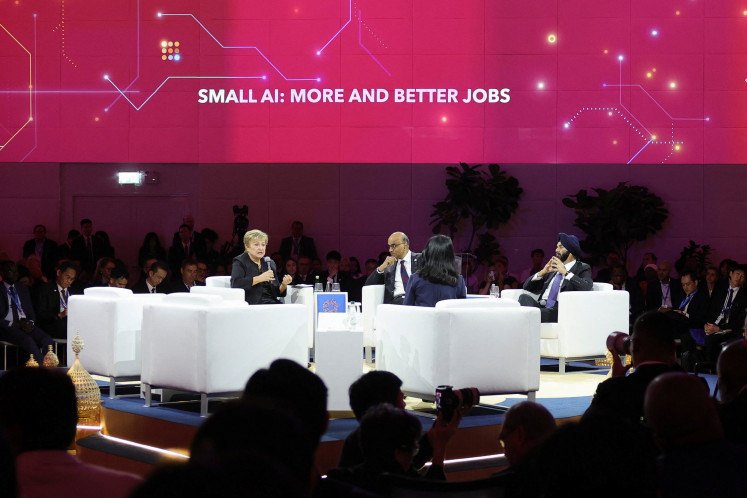 International Monetary Fund Managing Director Kristalina Georgieva speaks as Singapore's President Tharman Shanmugaratnam and World Bank Group President Ajay Banga look on during the IMF-World Bank 2026 Annual Meetings in Bangkok on Oct. 12, 2026.