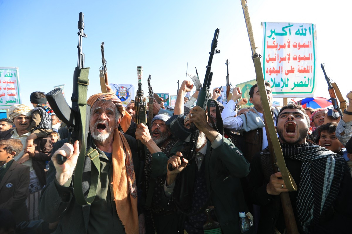 Supporters of the Houthi authorities brandish their weapons on Friday during a protest against Saudi intervention in Yemen, in Sanaa. The Houthis, who are fighting the Saudi-backed, internationally recognized government, seized the coastline alongside crucial trade route during a lightning offensive last month, extending their control over all of Yemen's Red Sea coast. Yemeni government forces have been attempting for several days to retake coastal territory captured by the pro-Iranian fighters. 