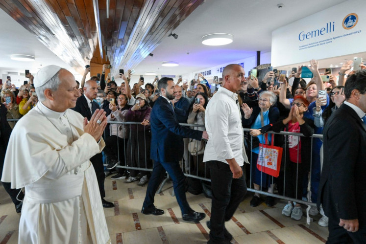 This photo taken and handout on October 13, 2026 by The Vatican Media shows Pope Leo XIV arrival at Rome's Gemelli University Hospital ahead of an operation to remove a lump from his lung.