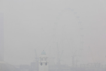 This picture provided by The Straits Times taken and received on October 14, 2026 shows the city shrouded with haze in Singapore. Air pollution in western Singapore hit the country's &ldquo;very high&ldquo; band on October 14, the environment agency said, as haze from Indonesia forest fires causes a regional crisis. 