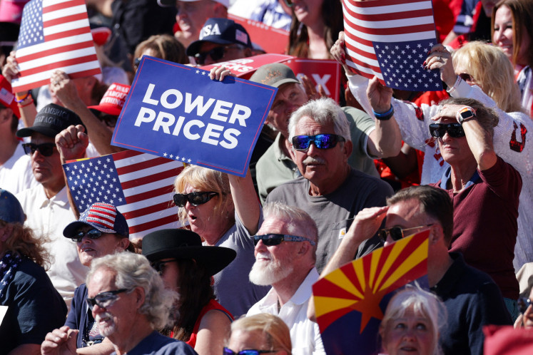 Attendees listen as US President Donald Trump speaks during a campaign rally at Laughlin/Bullhead International Airport on Oct. 14, 2026 in Bullhead City, Arizona.