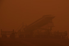Haze blankets Tjilik Riwut Airport in Palangka Raya, Central Kalimantan, on Oct. 14, 2026. Airport authorities temporarily suspended flights as smoke from wildfires reduced visibility.


