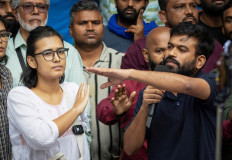 Abhijeet Dipke (right), founder of the Cockroach Janata Party (CJP), and Neha Bora, national president of the All India Students' Association (AISA), gesture as they address a press conference in New Delhi, India, on Oct. 15, 2026.
