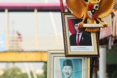 An image of Indonesian Vice President Gibran Rakabuming Raka is displayed in a frame outside a photo framing shop on Thursday in the Jatinegara area of East Jakarta