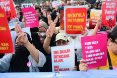 Demonstrators hold placards and raise three fingers in a salute symbolizing freedom, solidarity and equality during a protest in Jakarta on Oct. 20, 2026. The protesters called for an end to forest and land fires and demanded the eradication of corruption, collusion and nepotism as they marked the second anniversary of President Prabowo Subianto and Vice President Gibran Rakabuming Raka&rsquo;s administration.