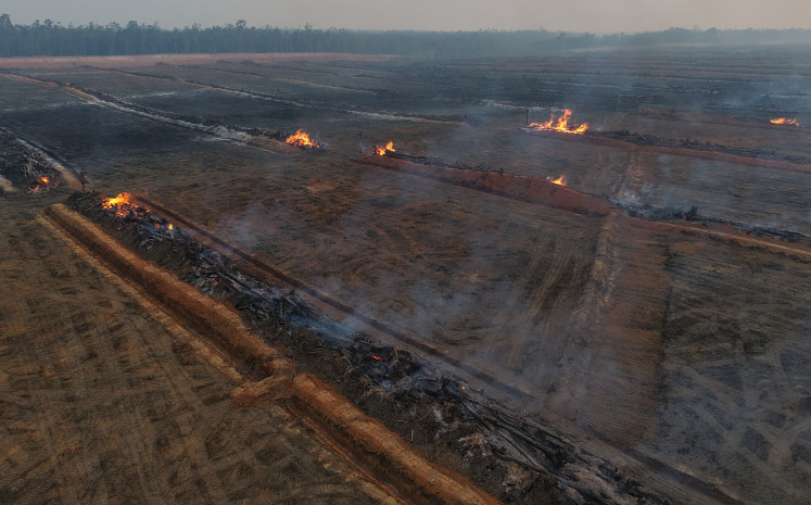Flames engulf parts of a 58-kilometer stretch of the Merauke food estate corridor on Aug. 12 in Merauke regency, South Papua, extending from near Wanam village in Ilwayab district to Muting district. Despite suffering one of Indonesia&rsquo;s largest burn scars, Papua remains excluded from areas prioritized for firefighting operations amid the regional haze crisis.