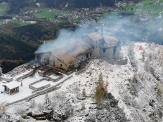 This Handout aerial photo made available by the Bavarian Police on October 24, 2026 shows the burnt mountain guesthouse Kehlsteinhaus, known as the Eagle's Nest, formerly Adolf Hitler's mountain retreat, after a large fire had broken out at the site located at an altitude of 1,834 metres (6,000 feet) in the mountains over Berchtesgaden, in the southern German state of Bavaria. 