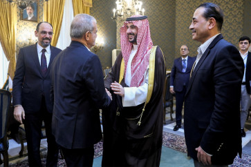 This handout picture provided by the Iranian presidency shows Iran's President Masoud Pezeshkian (center left) shaking hands with Saudi Arabia's Defense Minister Prince Khalid bin Salman Al-Saud after a meeting with the Pakistani army chief and the Turkish intelligence chief in Tehran on October 26, 2026. Iran began talks on October 26 with the three countries of the Mecca security pact, Pakistan, Saudi Arabia and Turkey, to discuss regional issues as the months-long Middle East war remains locked in a stalemate, state television reported. 