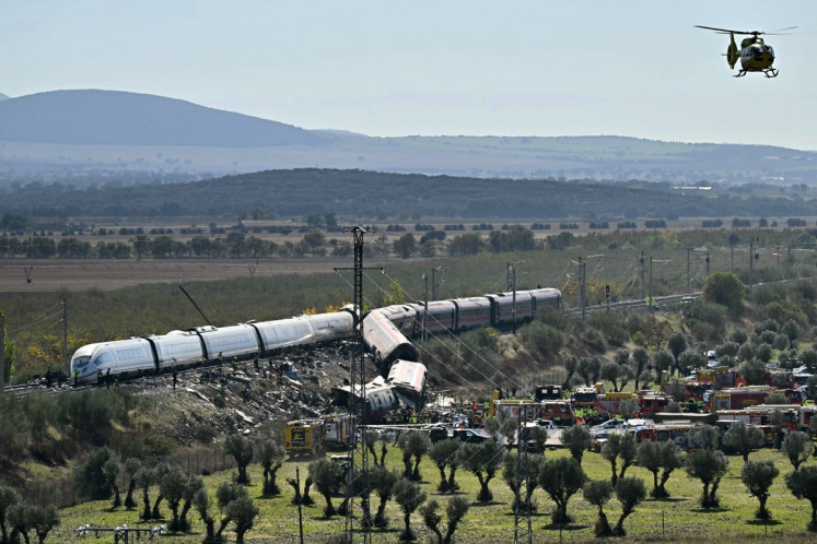 Emergency services work at the site of a train crash between two high-speed units, a Renfe AVE train and an Iryo train around 150 km south of Madrid between Urda and Los Yebenes in the province of Toledo, on October 28, 2026. A high-speed train collision south of Madrid killed 68 people and injured scores more today, with the toll likely to rise, authorities said in Spain's second such disaster this year.