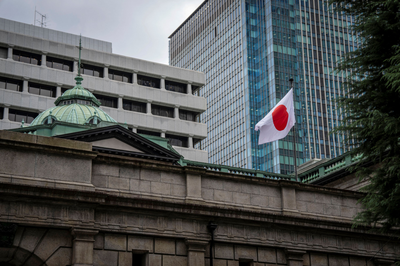 The Japanese national flag is seen at the Bank of Japan (BoJ) headquarters in Tokyo on September 1, 2026. 