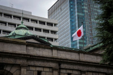 The Japanese national flag is seen at the Bank of Japan (BoJ) headquarters in Tokyo on September 1, 2026. 