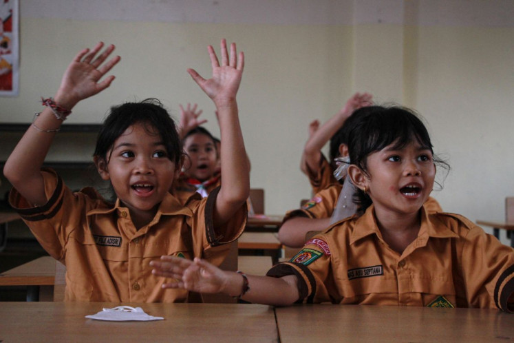 Back in school: Students participate in a classroom activity on Oct. 29, 2026 at SDN 4 Menteng public elementary school in Palangka Raya, Central Kalimantan, after two months of online learning due to haze.