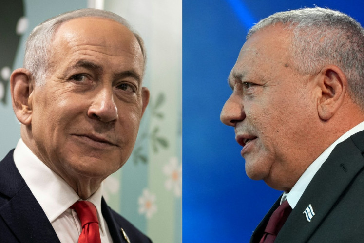 This combination of pictures created on October 28, 2026, shows Prime Minister Benjamin Netanyahu (left) speaking to the media after voting in Jerusalem on October 27, 2026, and Yashar party leader Gadi Eisenkot addressing his supporters at the election night rally in Tel Aviv early on October 28, 2026. The camp of Prime Minister Benjamin Netanyahu was ahead of his rival's opposition bloc but still short of a majority on October 28 after 50 percent of votes were counted in Israel's pivotal general election. 