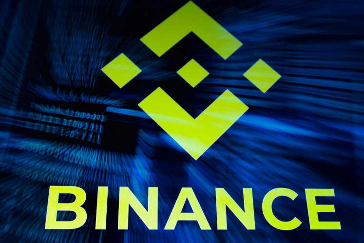 Binance logo and hacker code are seen in this illustration taken on Oct. 30, 2026.